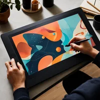 A designer drawing at a graphics tablet